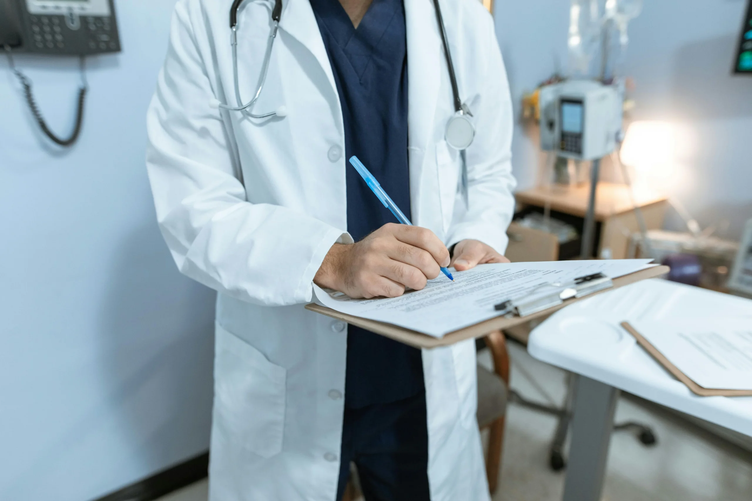 Doctor reviewing paperwork during an exam preparation consultation